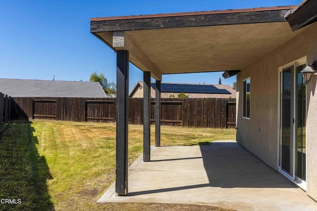 view of yard with a patio area and a fenced backyard