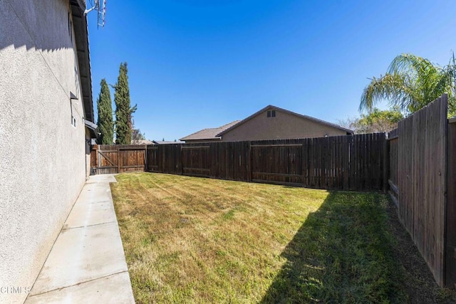 view of yard featuring a fenced backyard