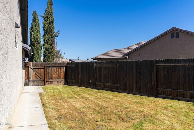 view of yard featuring a fenced backyard