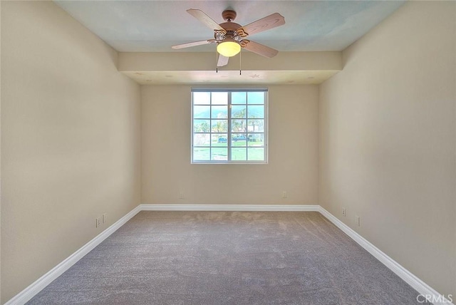 spare room featuring carpet flooring, a ceiling fan, and baseboards