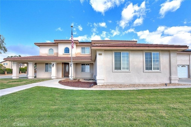 view of front of home featuring a front yard, roof mounted solar panels, and stucco siding