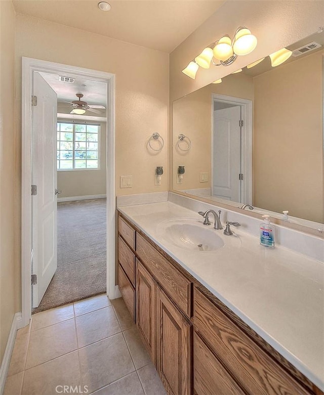 bathroom with vanity, tile patterned floors, baseboards, and visible vents