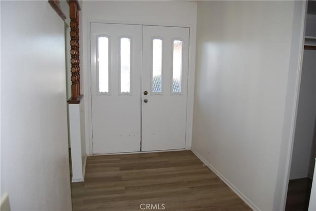 entrance foyer with wood finished floors and baseboards