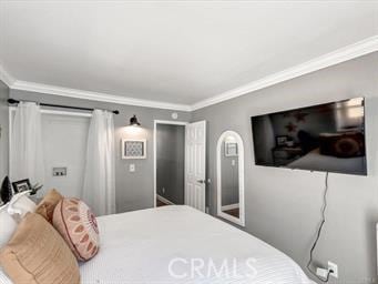 bedroom with ornamental molding