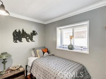 bedroom featuring ornamental molding