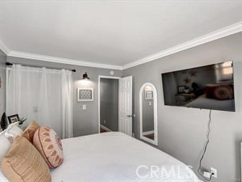 bedroom with ornamental molding