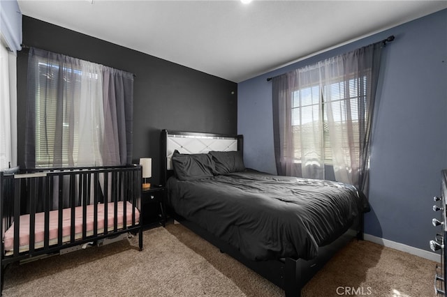 bedroom with carpet and baseboards