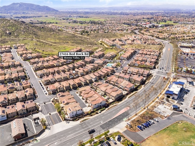 drone / aerial view featuring a mountain view and a residential view