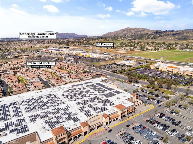 birds eye view of property featuring a mountain view