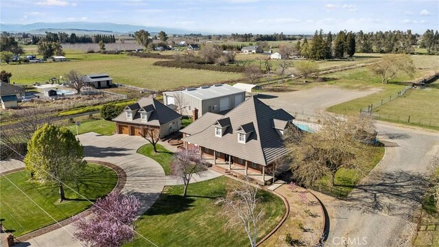 birds eye view of property with a rural view