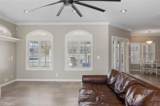 living room with ceiling fan, baseboards, ornamental molding, and recessed lighting