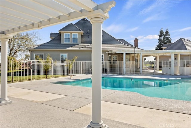 view of pool with a patio area, a fenced in pool, and fence