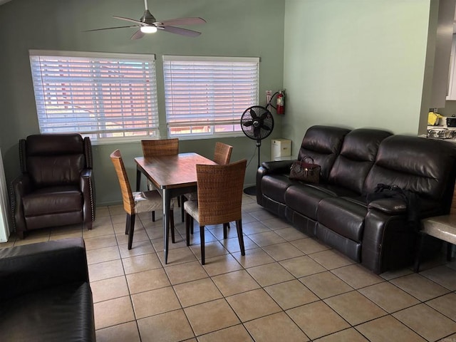 dining space featuring light tile patterned floors, a wealth of natural light, and ceiling fan