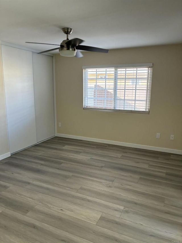 1549 Grand Teton Ct, Chula Vista, CA 91911 - empty room with a ceiling fan, plenty of natural light, and wood finished floors