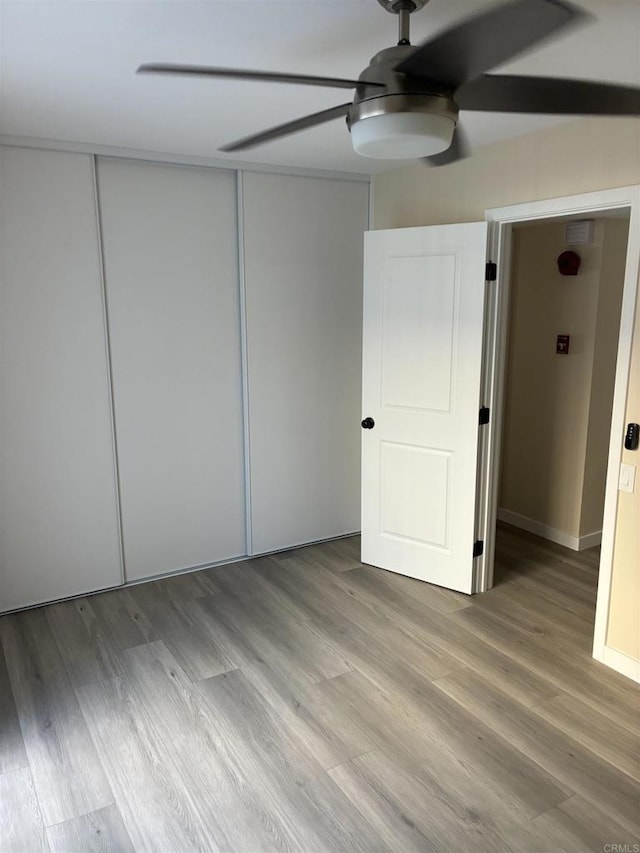 1549 Grand Teton Ct, Chula Vista, CA 91911 - unfurnished bedroom featuring wood finished floors, a closet, and ceiling fan