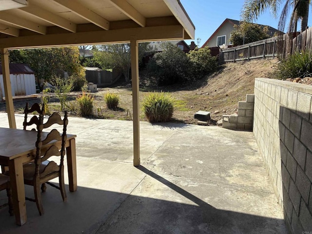 1549 Grand Teton Ct, Chula Vista, CA 91911 - fenced backyard with a patio, outdoor dining space, and a shed