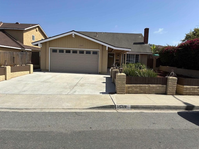 1549 Grand Teton Ct, Chula Vista, CA 91911 - view of front of property with a garage, concrete driveway, and a chimney