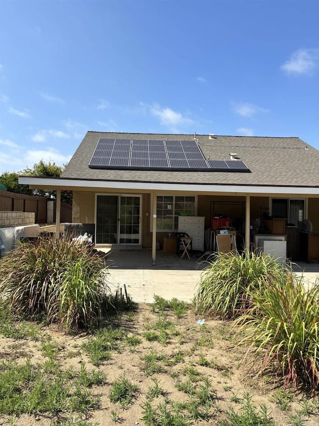1549 Grand Teton Ct, Chula Vista, CA 91911 - rear view of property featuring a patio, solar panels, and roof with shingles