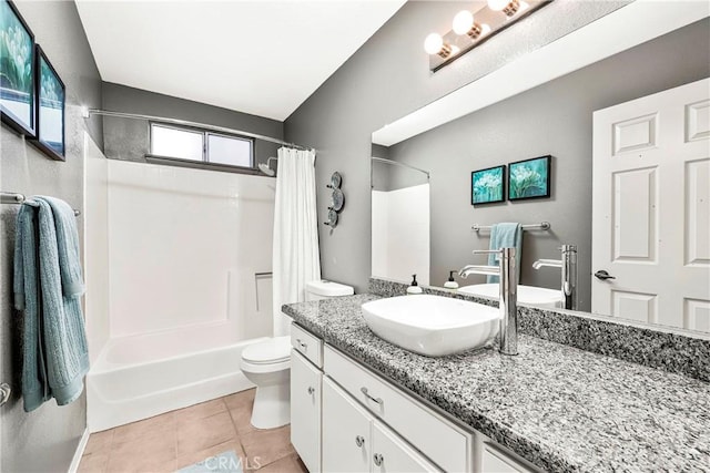 full bathroom featuring vanity, tile patterned floors, toilet, and shower / bath combo