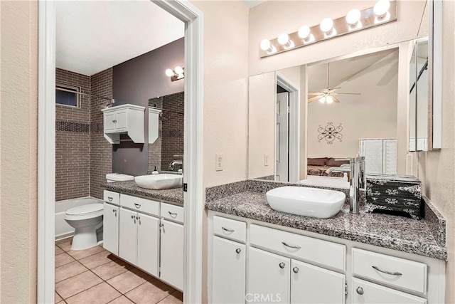 full bathroom with tile patterned flooring, two vanities, a ceiling fan, and a sink