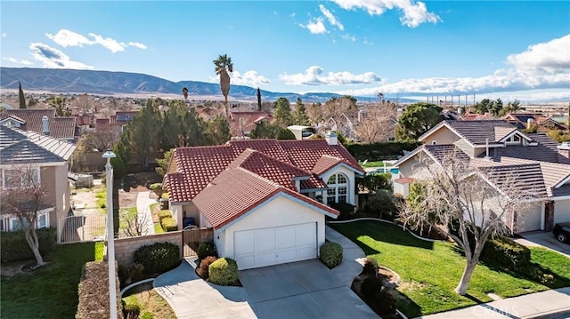 birds eye view of property featuring a mountain view and a residential view