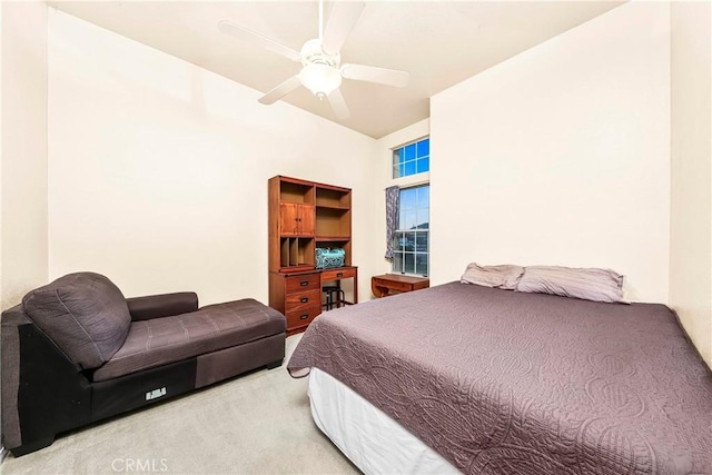 bedroom featuring a ceiling fan and carpet