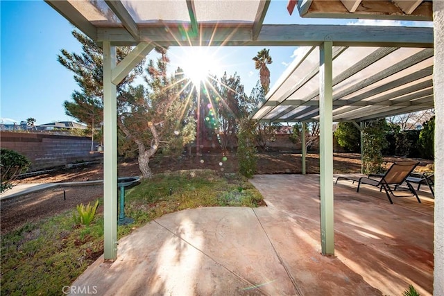 view of patio / terrace with a fenced backyard and a pergola