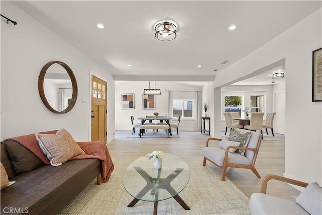 living room featuring recessed lighting and light wood-style flooring