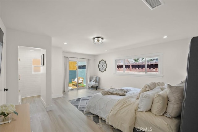 bedroom featuring visible vents, light wood-style flooring, recessed lighting, baseboards, and access to exterior