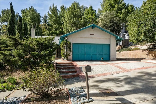 exterior space with decorative driveway