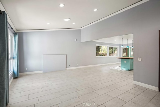 spare room featuring recessed lighting, baseboards, and ornamental molding