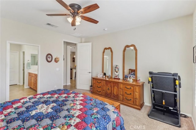 bedroom with visible vents, connected bathroom, and a ceiling fan