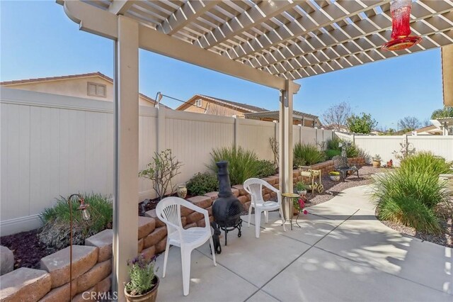 view of patio with a fenced backyard and a pergola