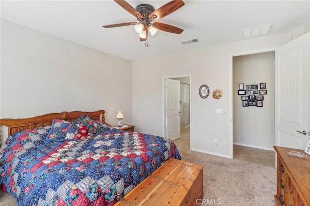 bedroom with ceiling fan, baseboards, visible vents, and light carpet