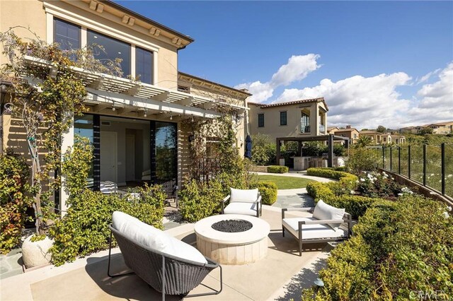 view of patio / terrace featuring a fire pit and a pergola