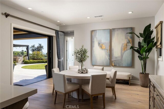 dining room with recessed lighting, visible vents, and light wood-style floors