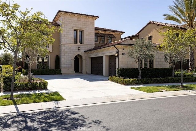 view of front facade with an attached garage and concrete driveway