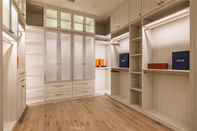 walk in closet with visible vents and light wood-style flooring