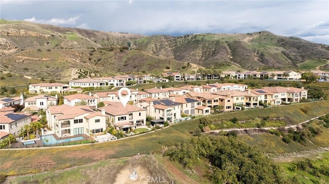 aerial view with a mountain view and a residential view