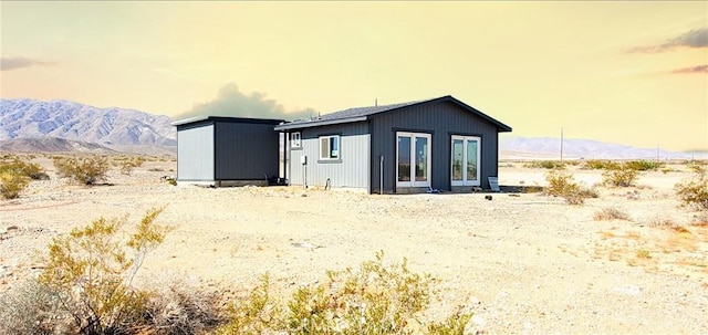 back of property featuring a mountain view