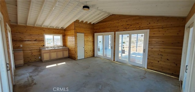 interior space with vaulted ceiling and a sink