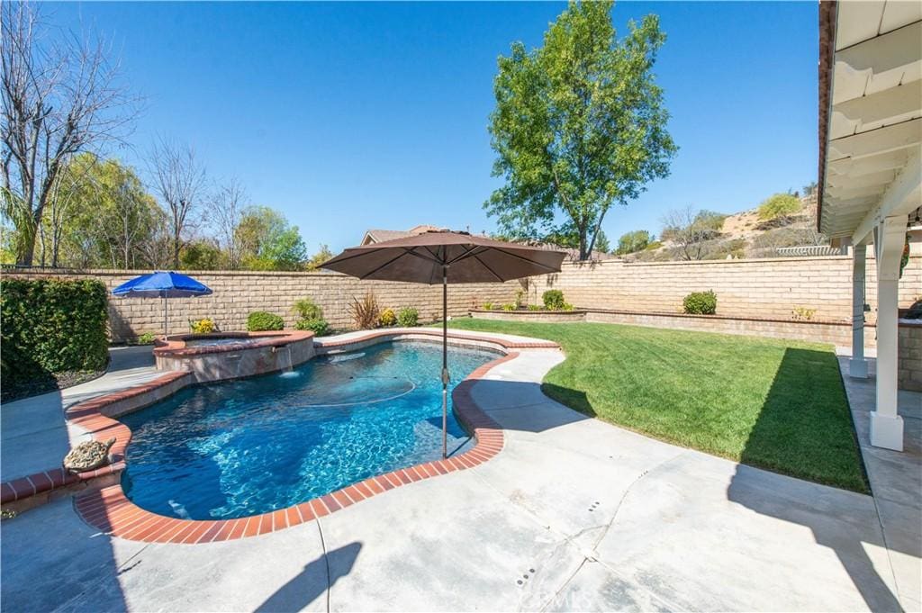 28334 Alton Way, Castaic, CA 91384 - view of pool with a fenced backyard, a lawn, a pool with connected hot tub, and a patio