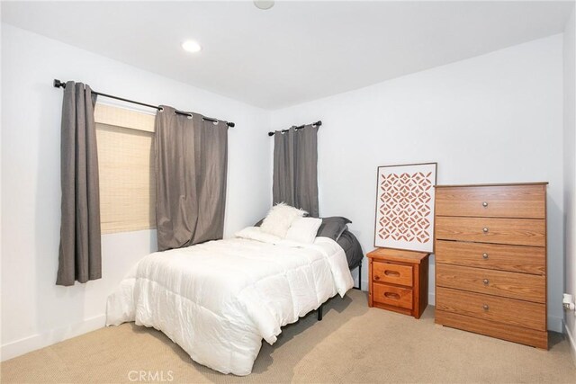 bedroom with recessed lighting, baseboards, and light colored carpet