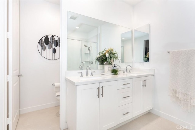 full bath with double vanity, an enclosed shower, tile patterned floors, and a sink