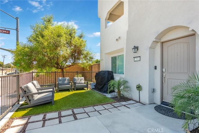 view of yard with a patio area, fence, and an outdoor hangout area