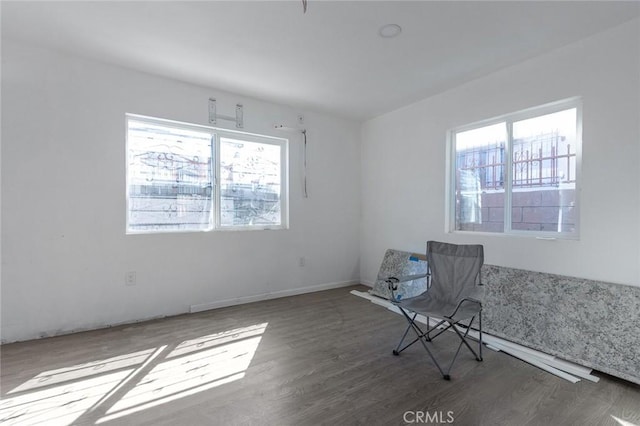 spare room featuring wood finished floors