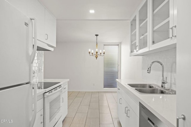 kitchen featuring a sink, under cabinet range hood, white appliances, white cabinets, and decorative backsplash