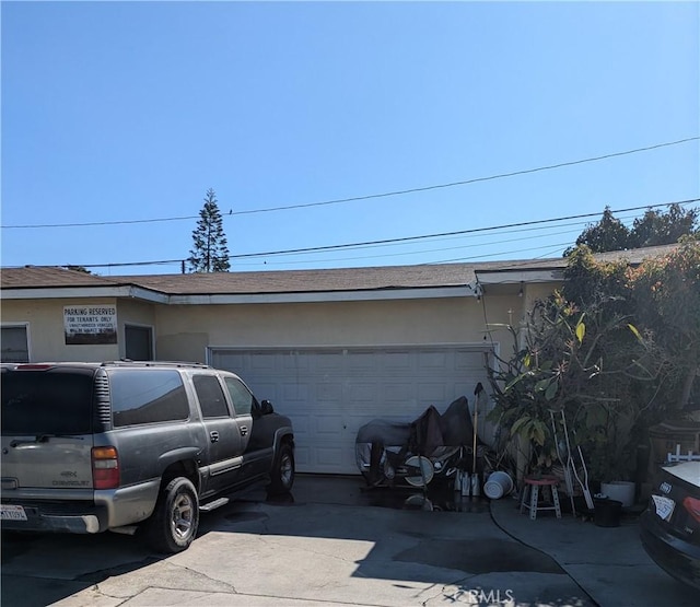 exterior space with concrete driveway