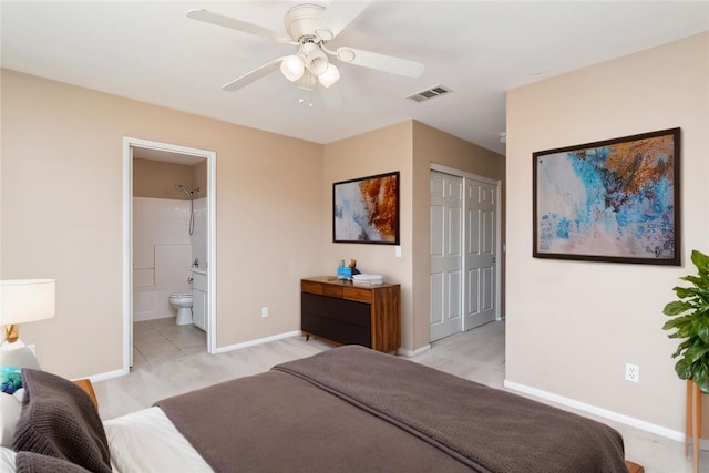 bedroom with visible vents, ensuite bath, a closet, baseboards, and ceiling fan