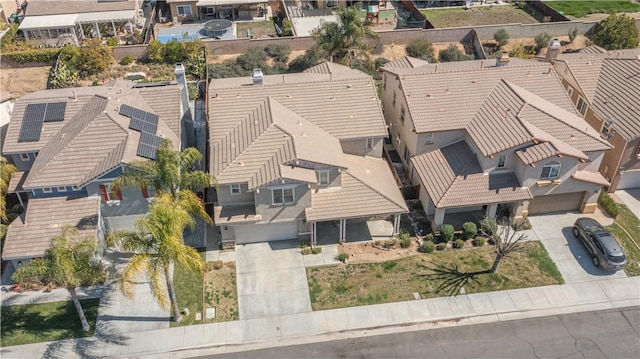 birds eye view of property with a residential view